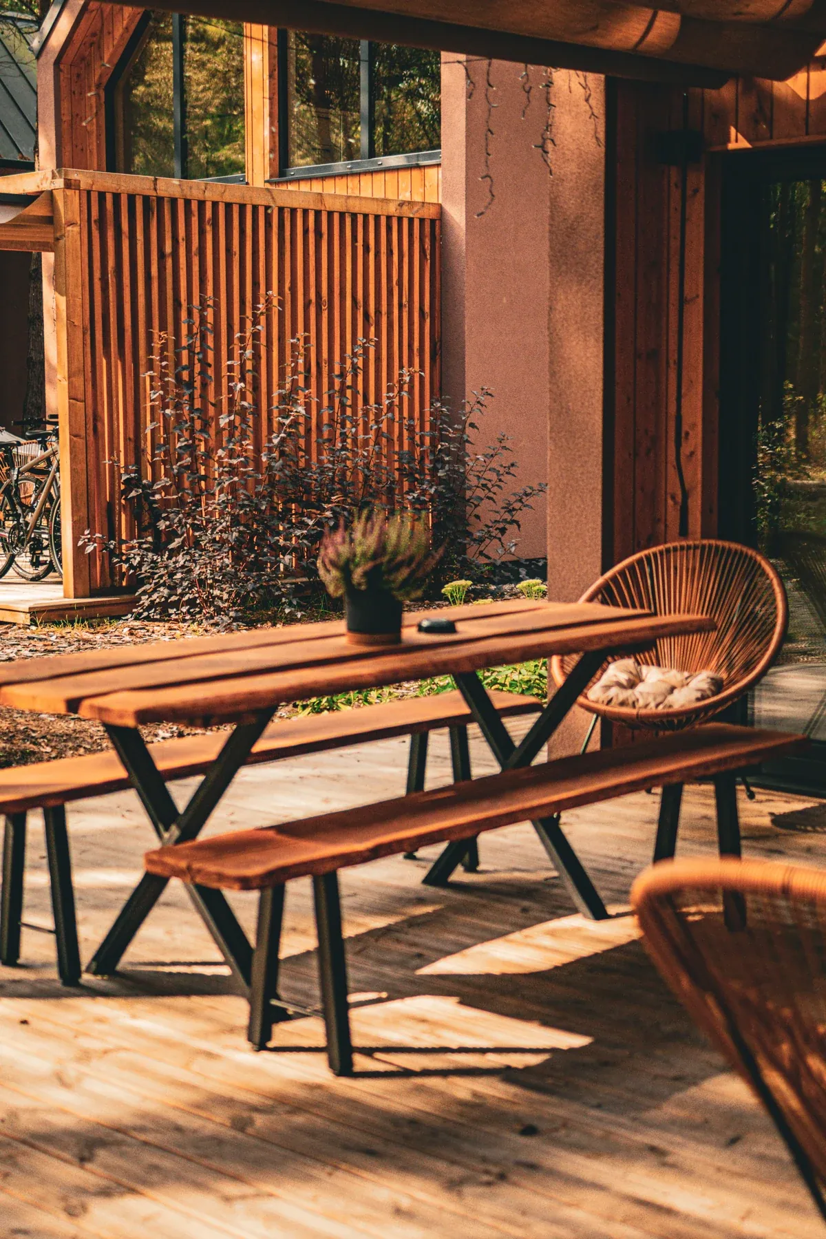 A table and chairs on a wooden terrace