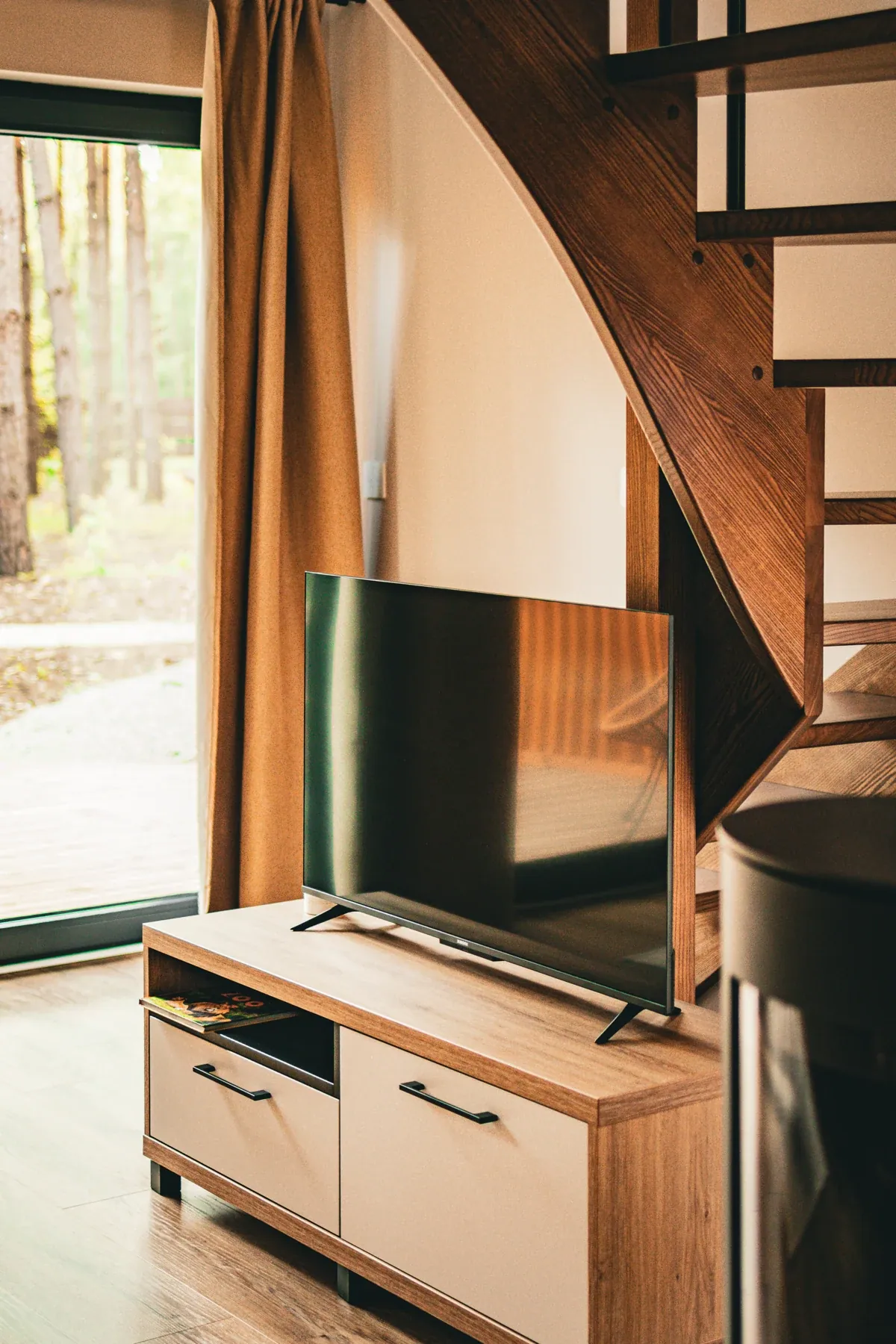 The television and stairs to the mezzanine