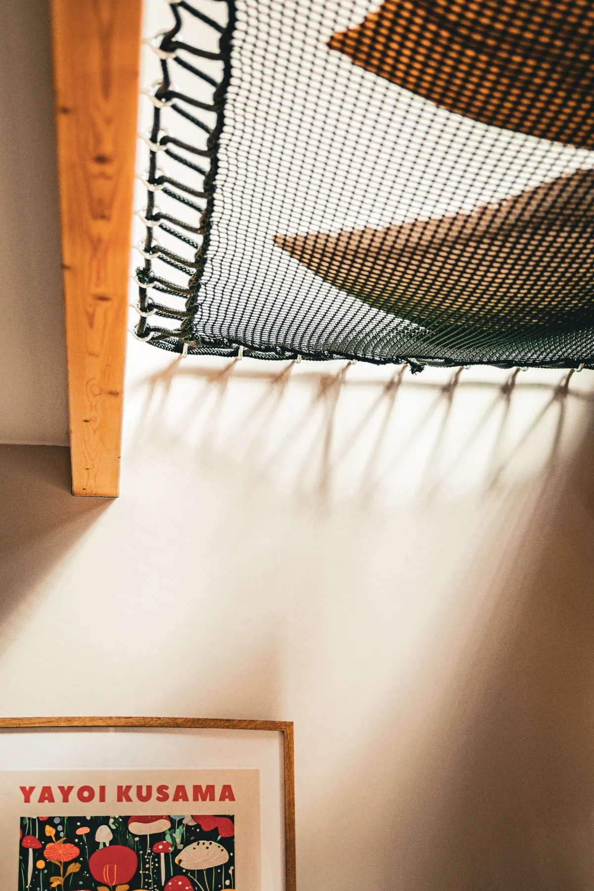 A mezzanine hammock and wall artwork