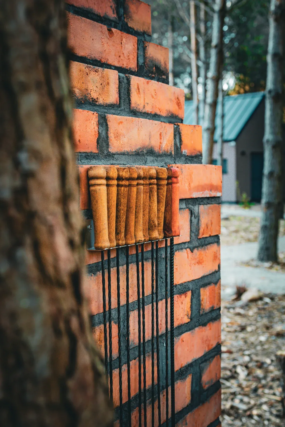 Barbecue utensils beside the brick barbecue