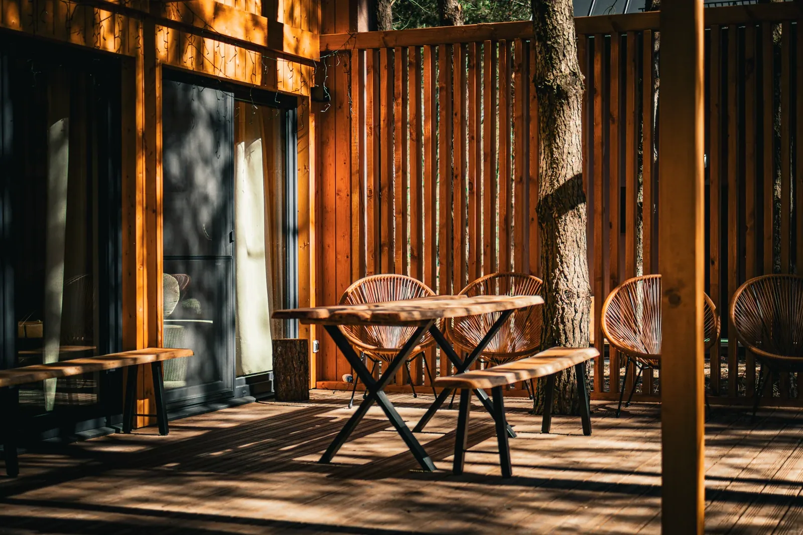 A wooden table on a sunny terrace