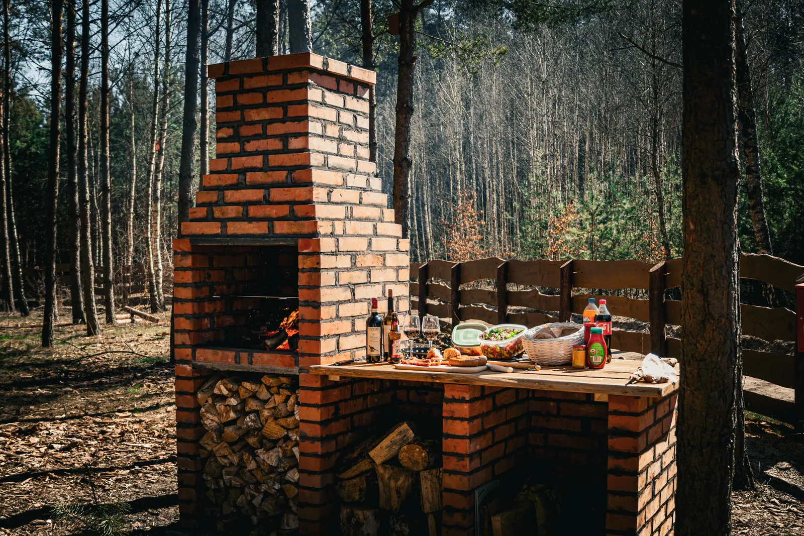 The outdoor kitchen beside the brick barbecue