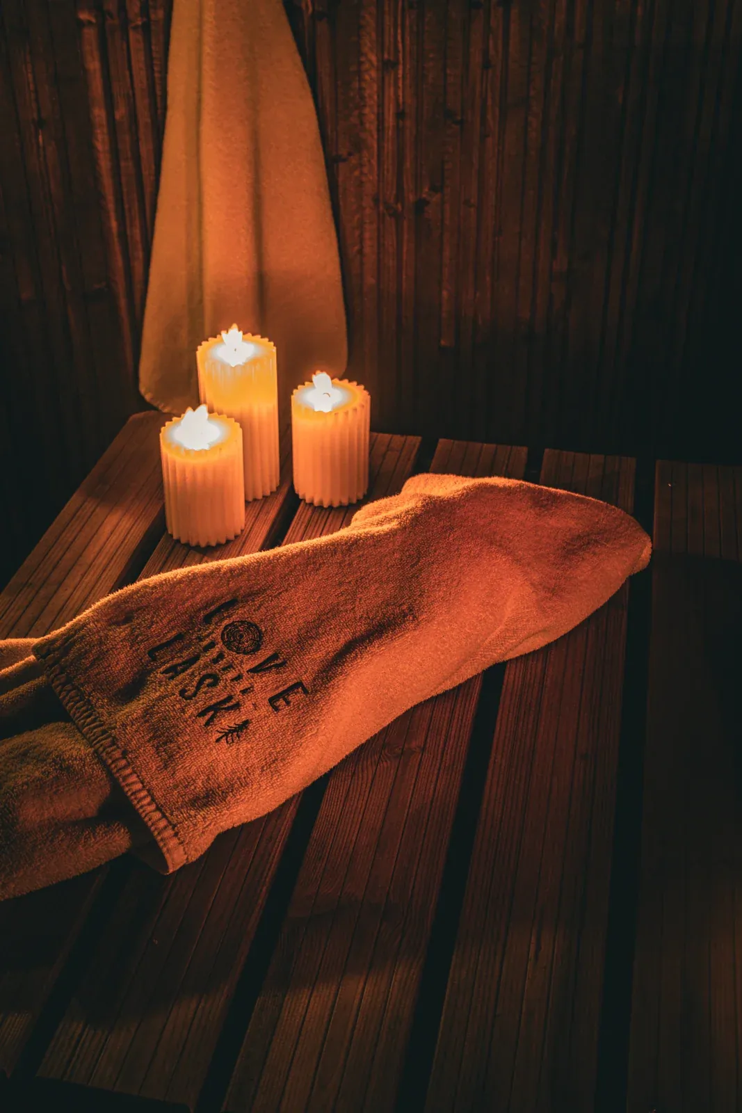 Candles and towels beside the hot tub