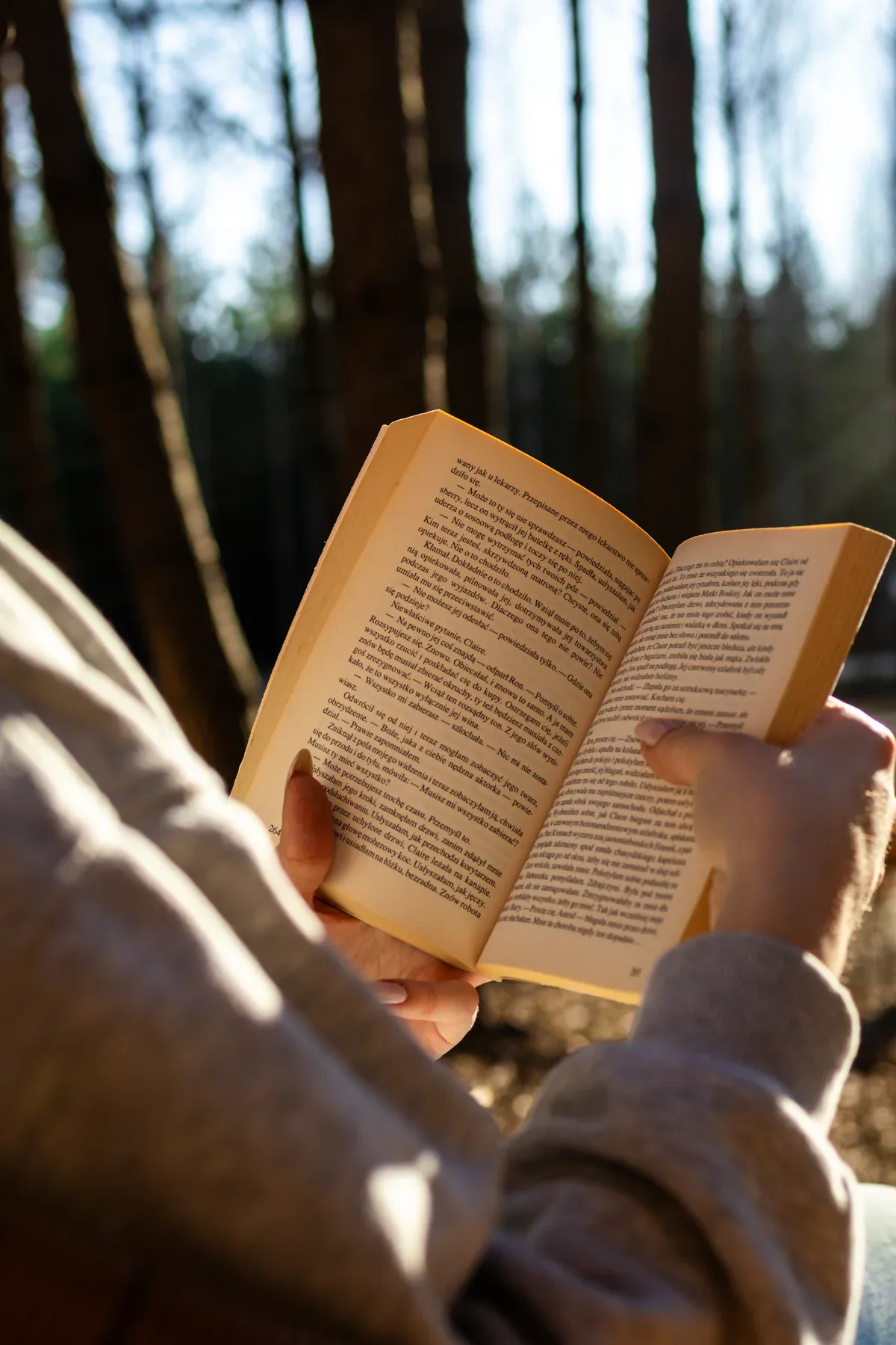 Reading a book by the window