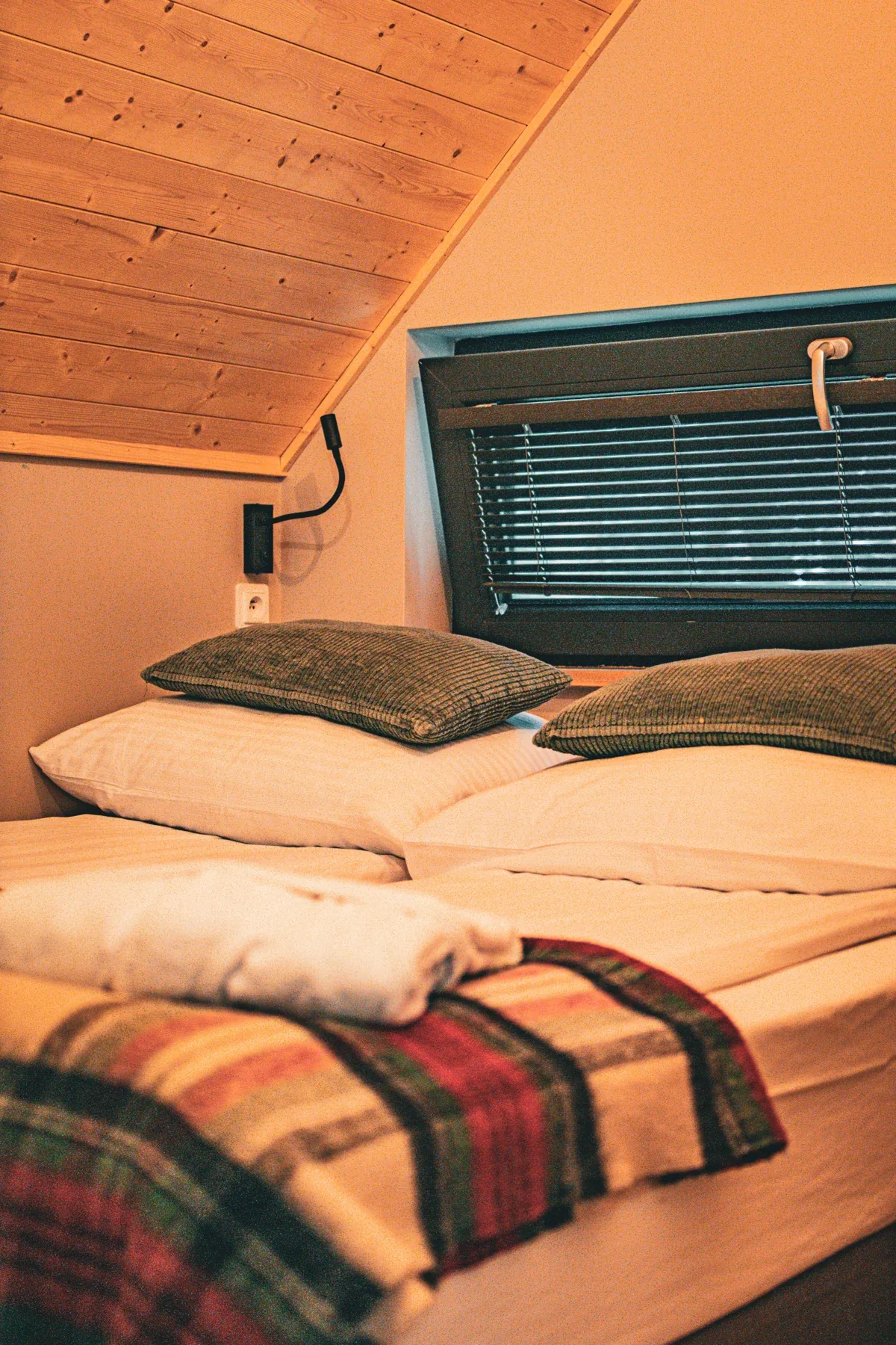 The bed in a cabin bedroom