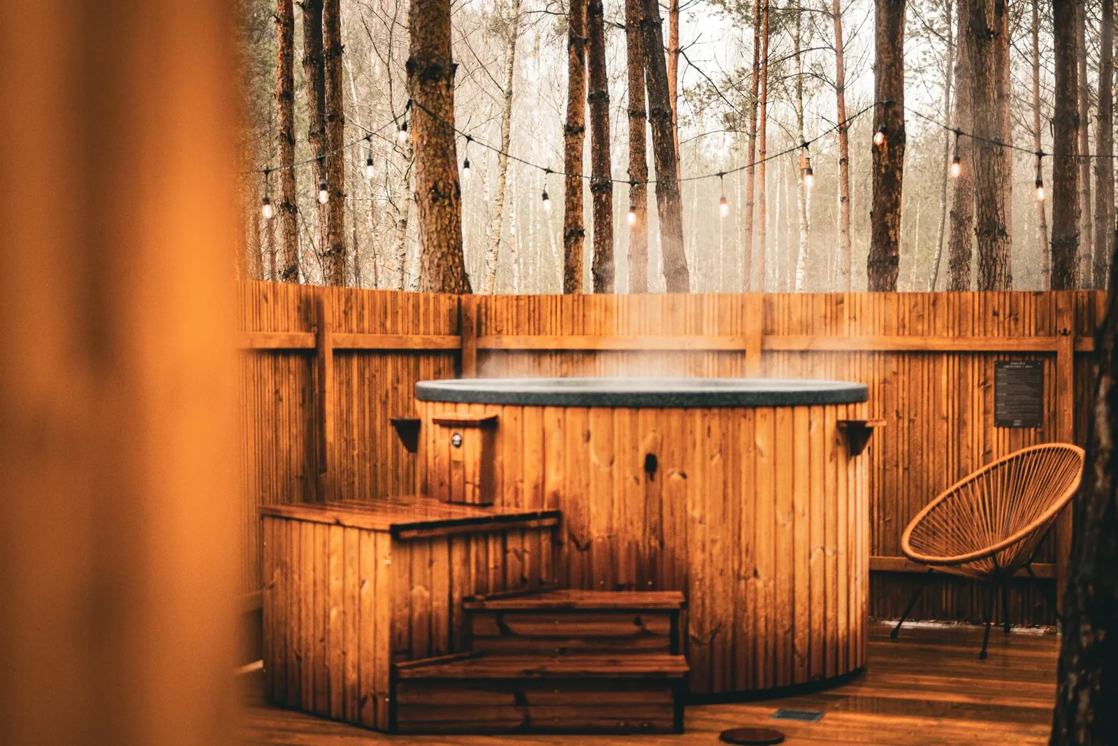 The warm hot tub in the pine forest