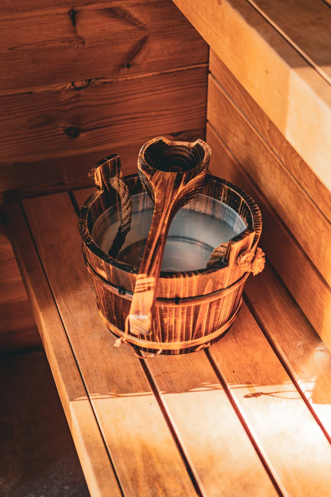 A wooden bucket and ladle in the sauna