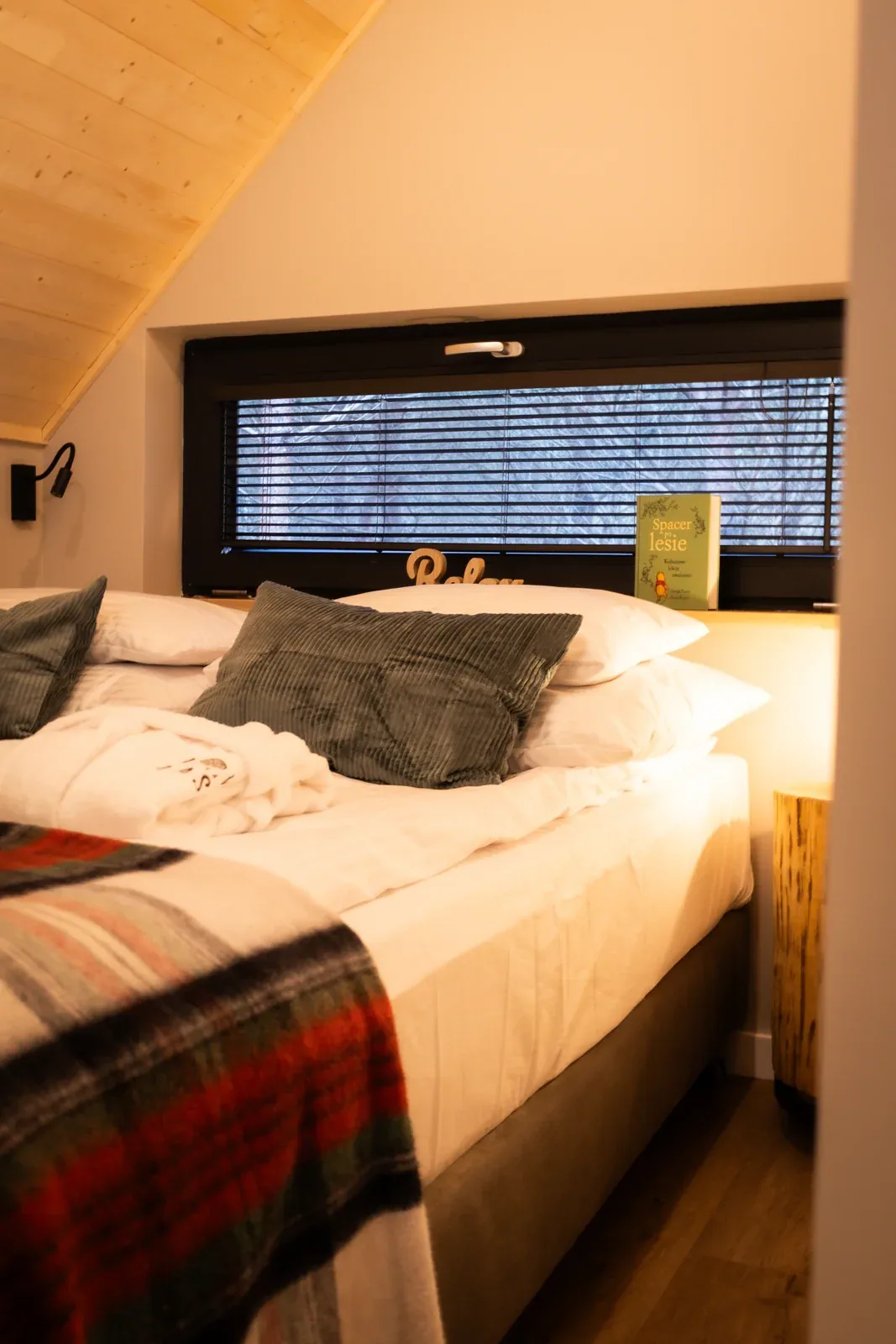 The bed and cushions in the bedroom