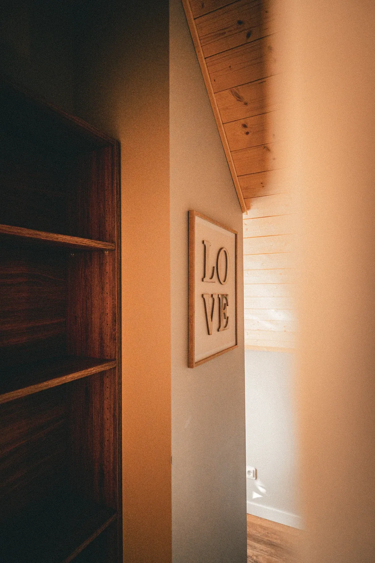 Wooden details beside a room entrance