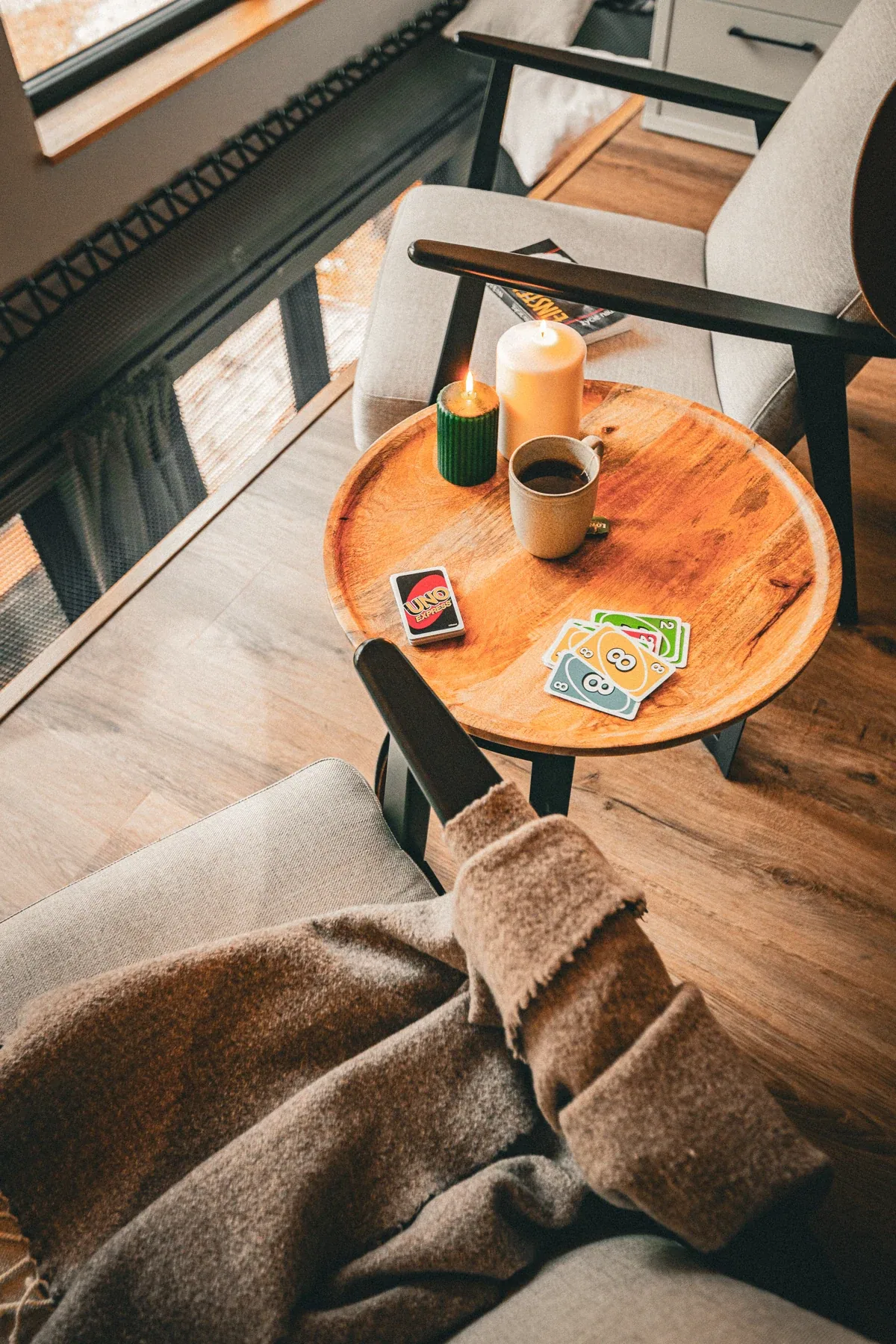 A table, coffee and a book by the window